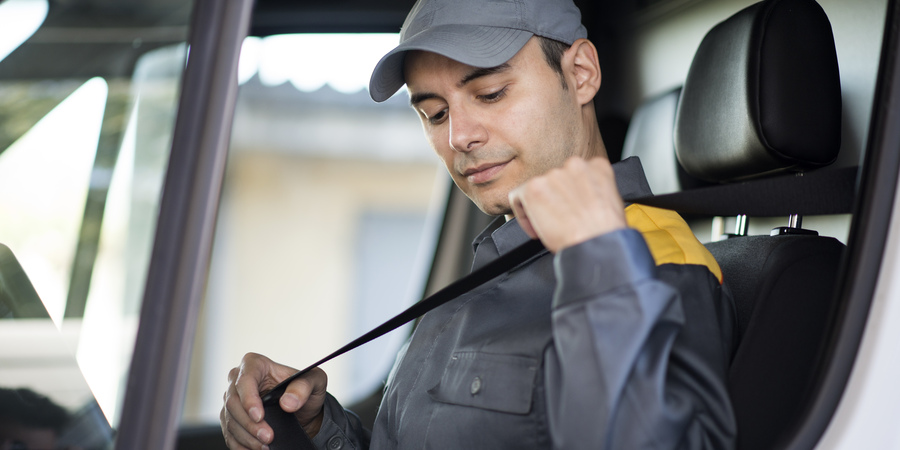 deliverer-putting-safety-belt-his-van.jpg